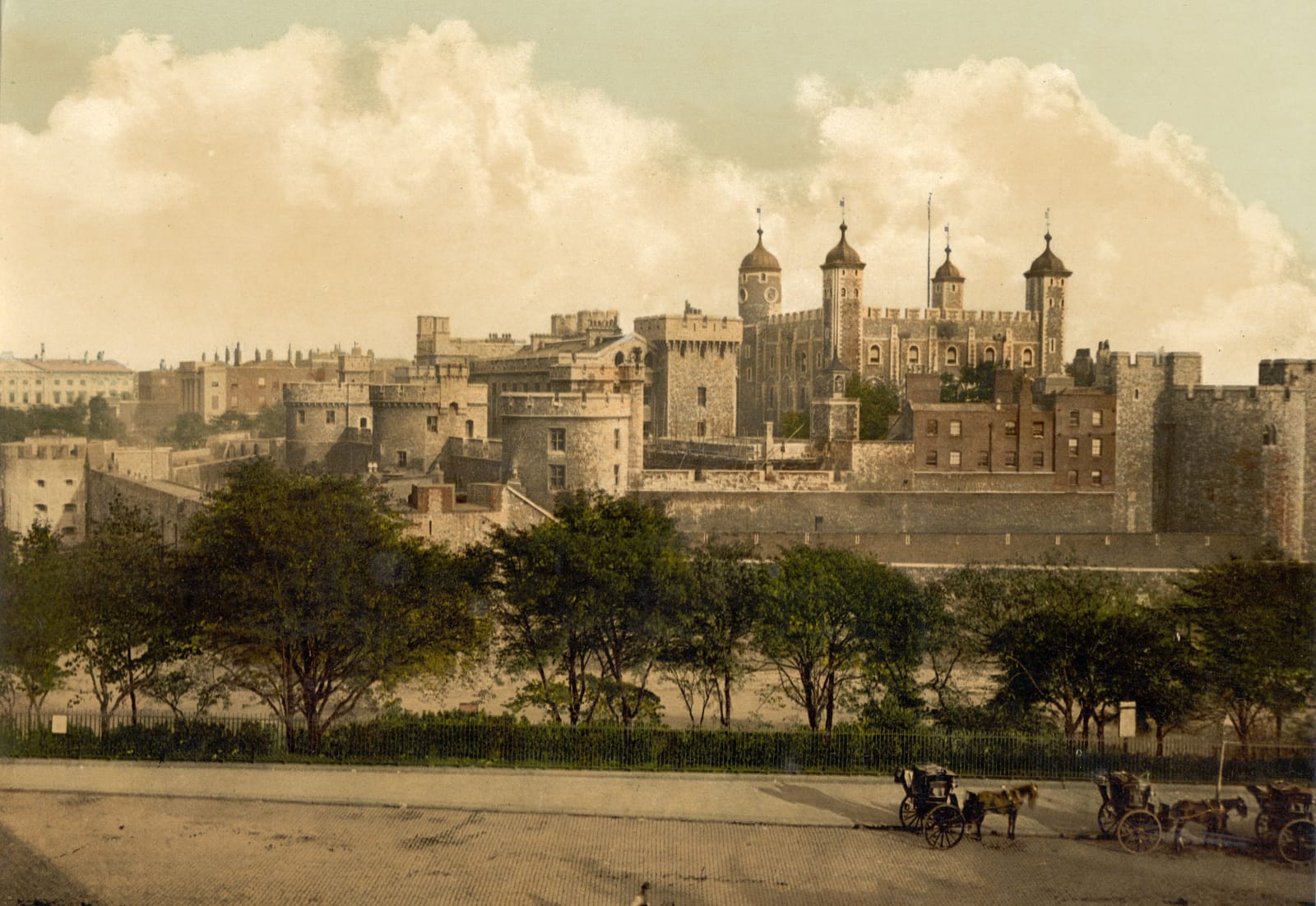 The Tower of London seen from Tower Hill, with the White Tower and its four turrets rising behind the outer walls